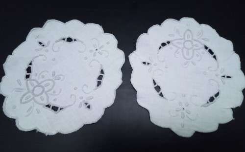 Two lovely small embroidered cutwork doilies