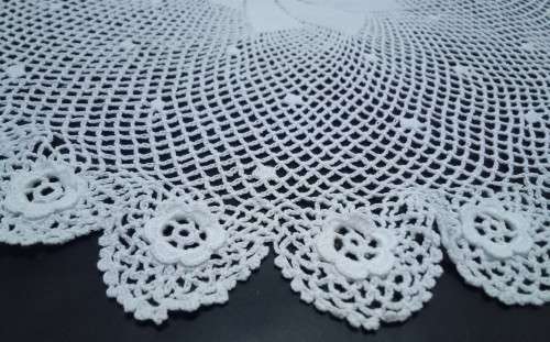 Exquisitely fine crocheted vintage round doily