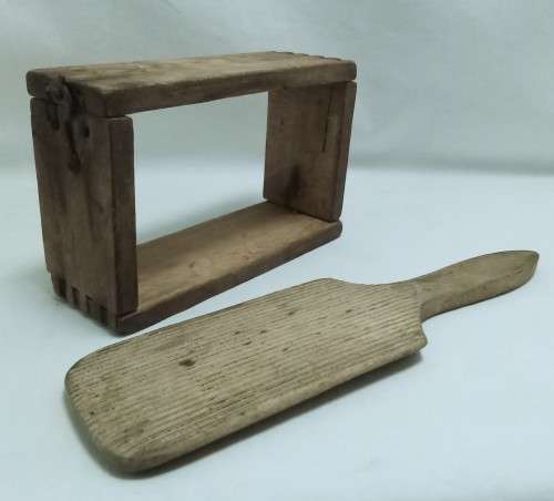 Antique butter mould and paddle