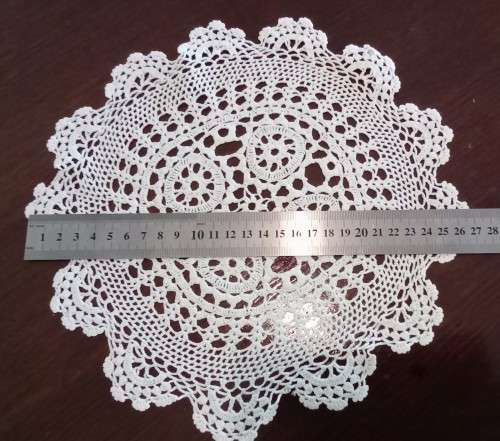 Beautiful crocheted doily - 27cms across