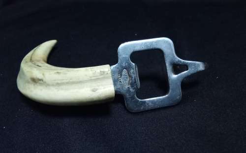 Vintage tusk bottle opener and tongs