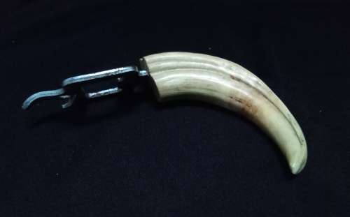 Vintage tusk bottle opener and tongs