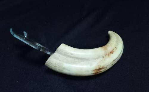 Vintage tusk bottle opener and tongs