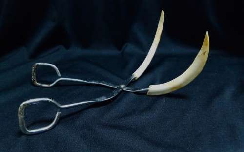 Vintage tusk bottle opener and tongs