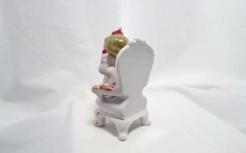 Most beautiful vintage brat! Crying baby on chair figurine