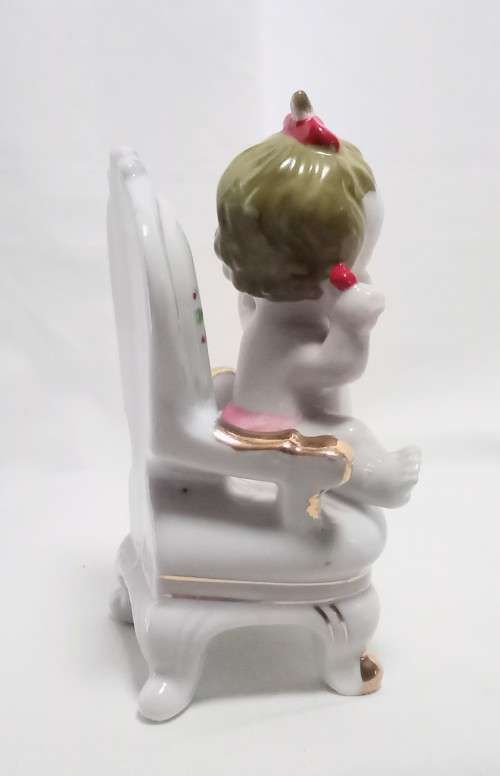 Most beautiful vintage brat! Crying baby on chair figurine