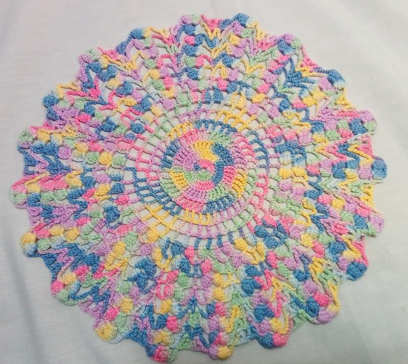 Vintage hand crocheted multi coloured doily