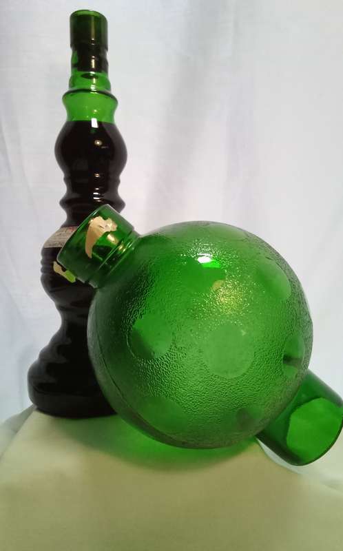 Beautiful vintage green glass Chianti wine bottle with glass shade