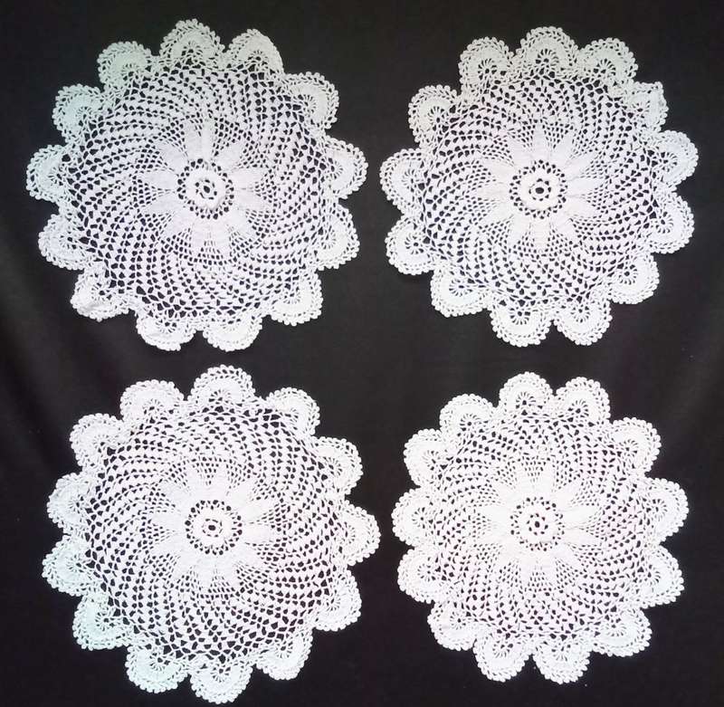 4 Beautiful Crocheted doiles - about 16cms across