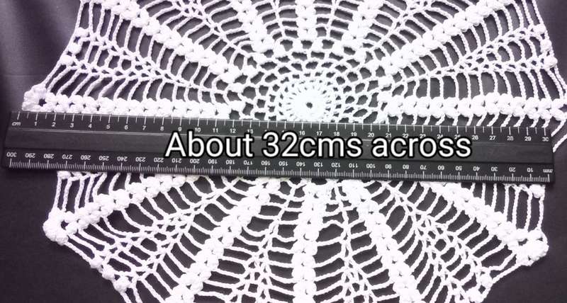 Pretty crocheted doily - about 32cms across
