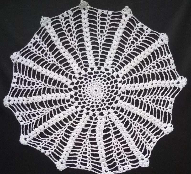 Pretty crocheted doily - about 32cms across