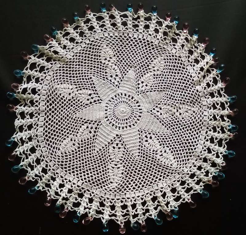 Magnificent beaded hand crocheted doily/jug cover - about 23cms across