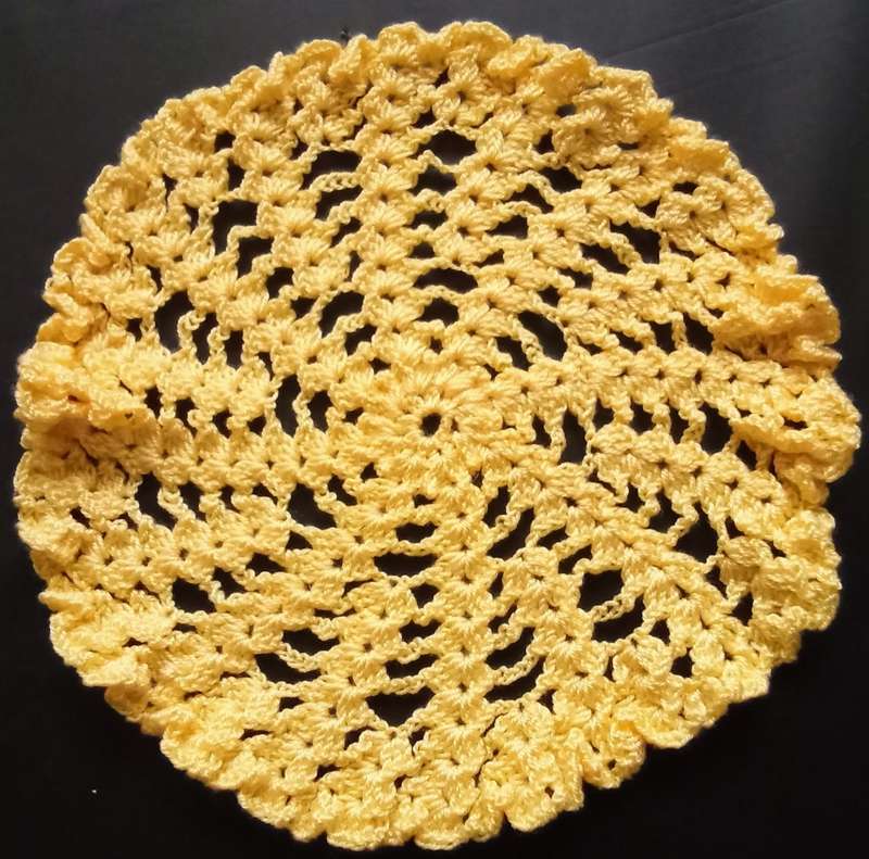 Cute yellow hand crocheted doily - about 18.5cms across