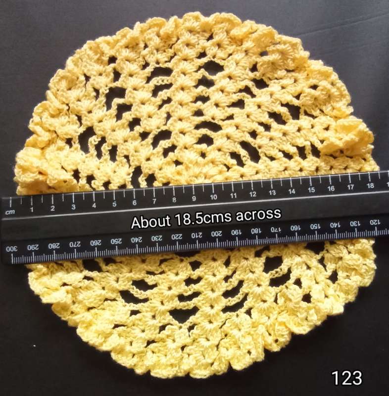 Cute yellow hand crocheted doily - about 18.5cms across