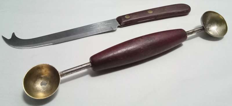 Two vintage utensils - cheese knife and melon baller