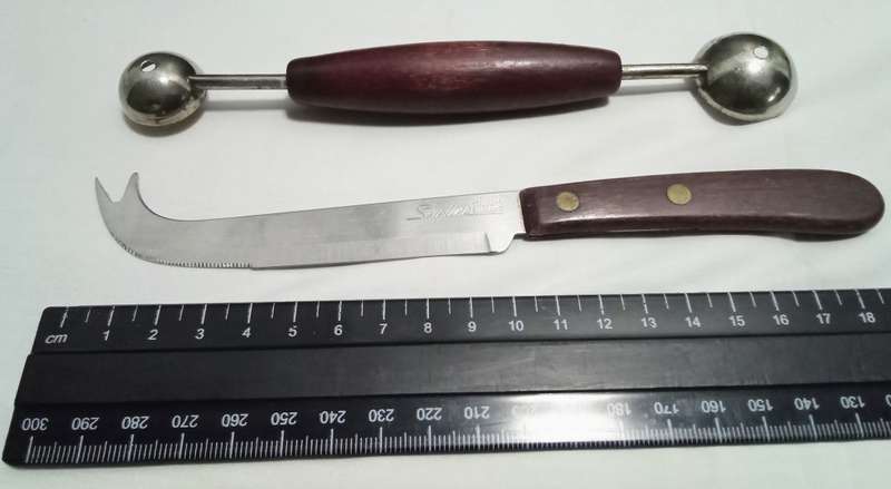 Two vintage utensils - cheese knife and melon baller