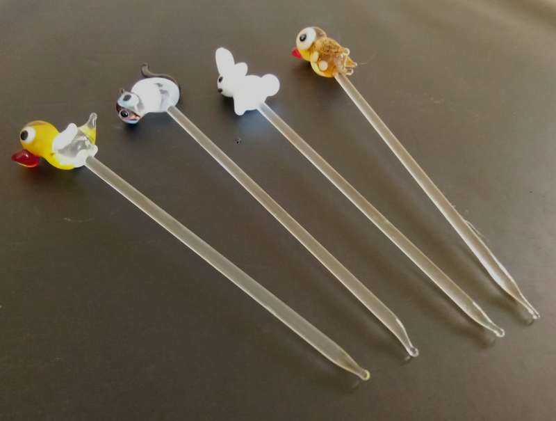 Four Vintage glass swizzle sticks