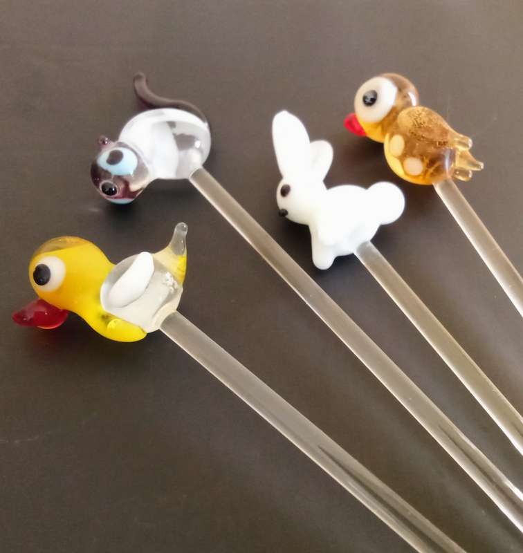 Four Vintage glass swizzle sticks