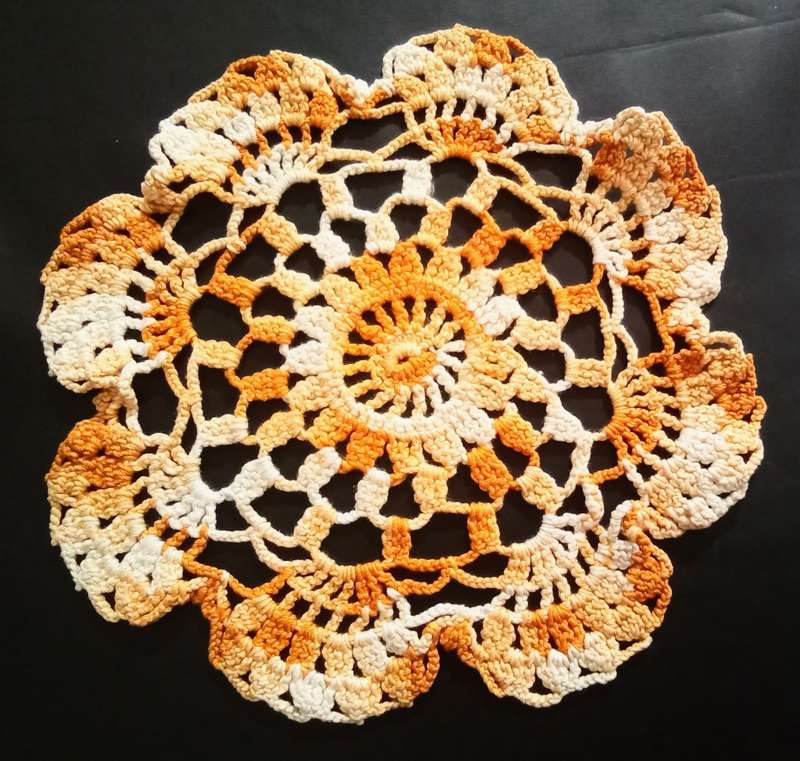 Lovely vintage hand crocheted small orange doily