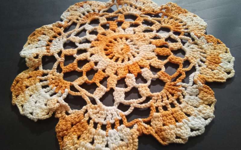 Lovely vintage hand crocheted small orange doily