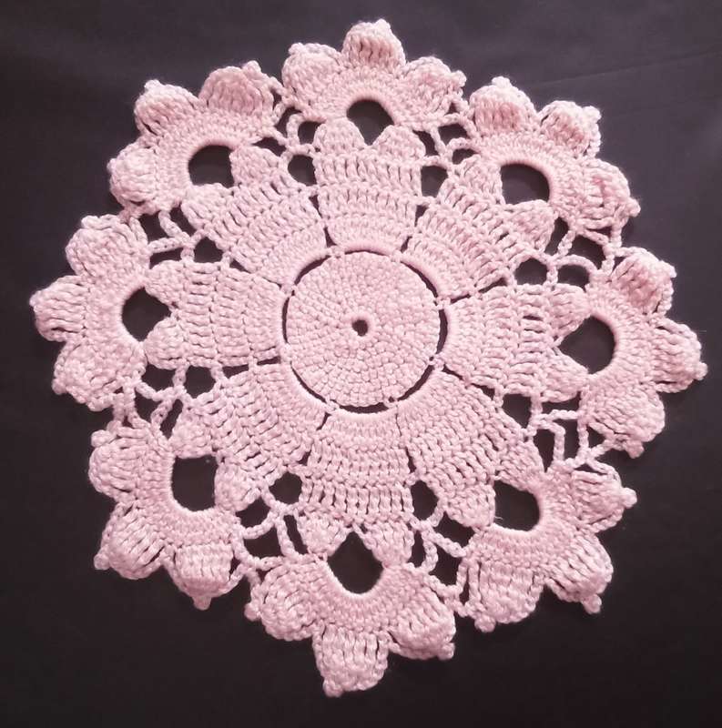 Lovely pink hand crocheted vintage doily