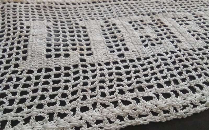 Notably unique white hand crocheted vintage doily