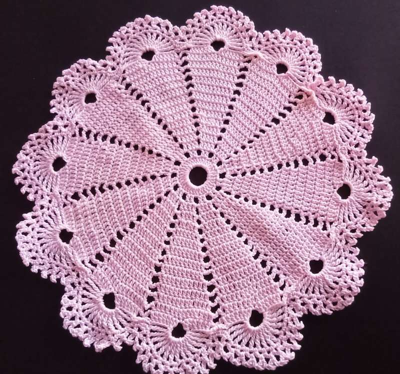 Beautiful vintage crocheted pink doily