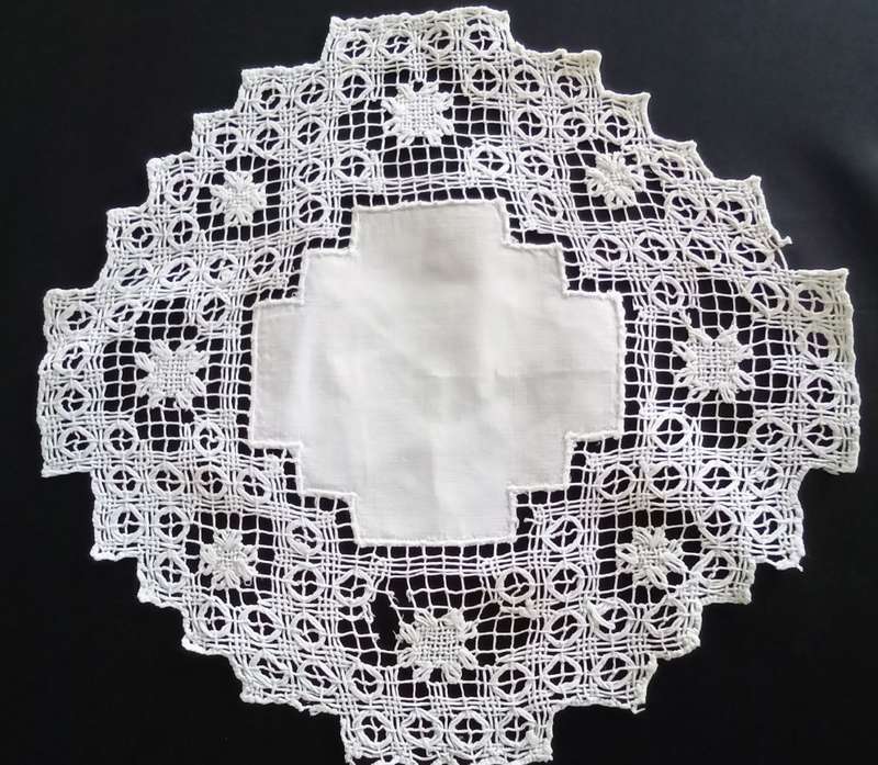 Very interesting crocheted white doily