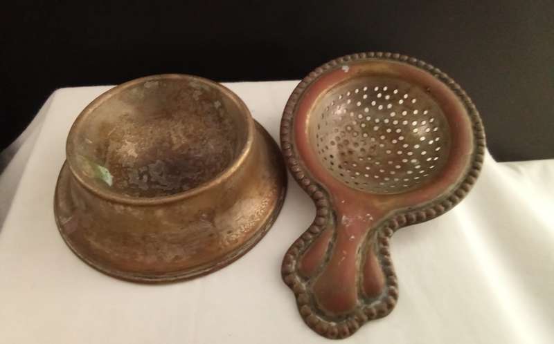 Very old tea strainer with holder