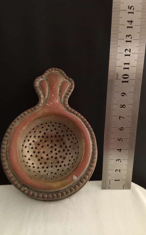 Very old tea strainer with holder