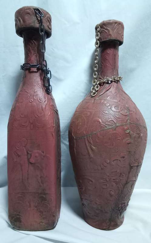 Two beautiful vintage leather clad wine bottles