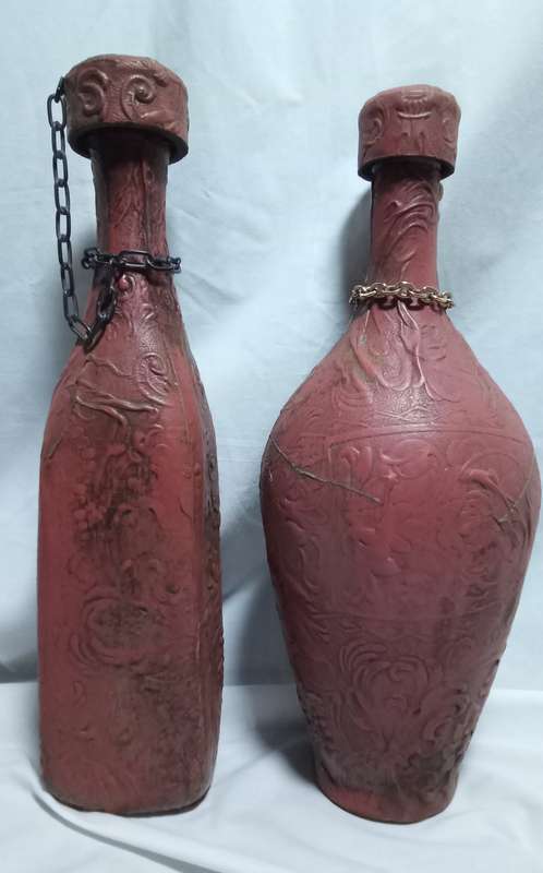 Two beautiful vintage leather clad wine bottles