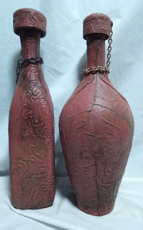 Two beautiful vintage leather clad wine bottles