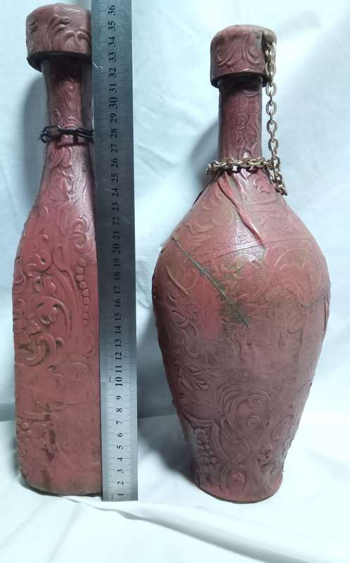 Two beautiful vintage leather clad wine bottles