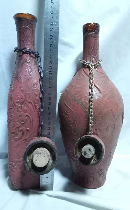 Two beautiful vintage leather clad wine bottles