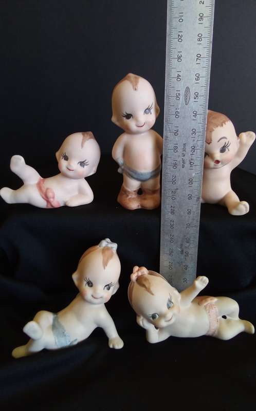 Beautiful set of 5 hand painted porcelain kewpies