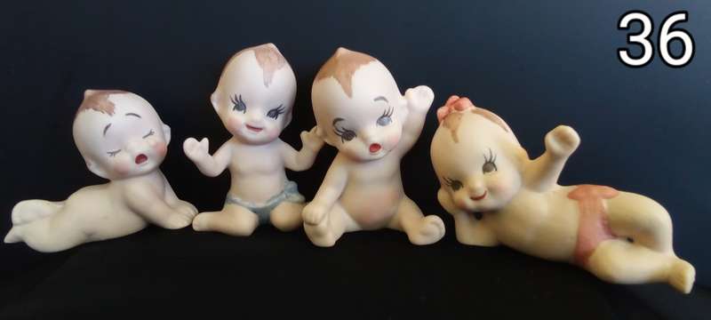 Beautiful set of 4 hand painted porcelain kewpies