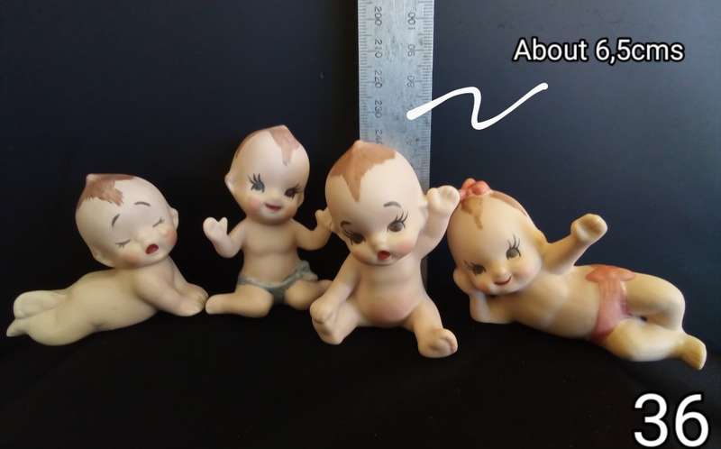 Beautiful set of 4 hand painted porcelain kewpies