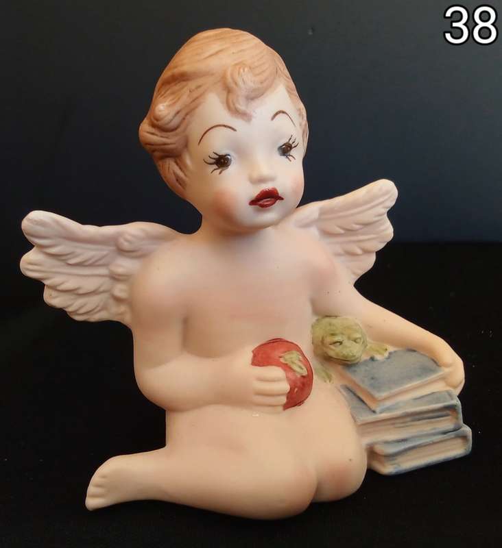 Beautiful  hand painted porcelain Angel with blue books