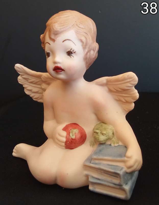 Beautiful  hand painted porcelain Angel with blue books