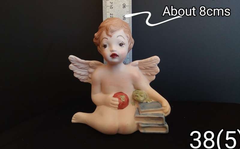 Beautiful  hand painted porcelain Angel with blue books