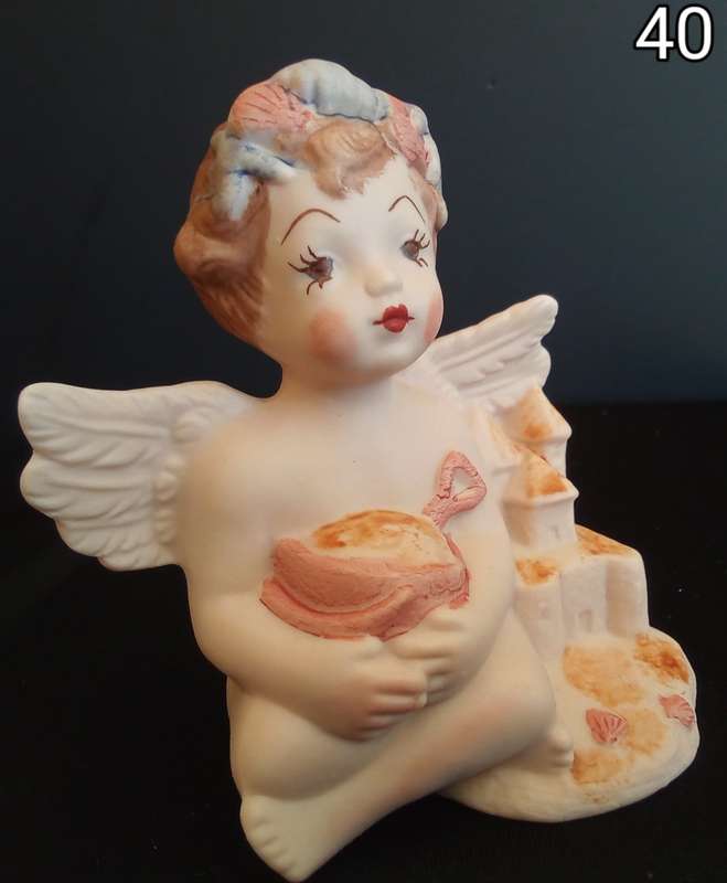 Beautiful  hand painted porcelain Angel with orange beach bucket