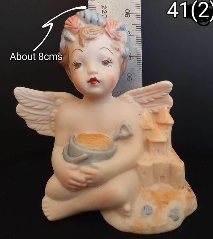 Beautiful  hand painted porcelain Angel with blue beach bucket