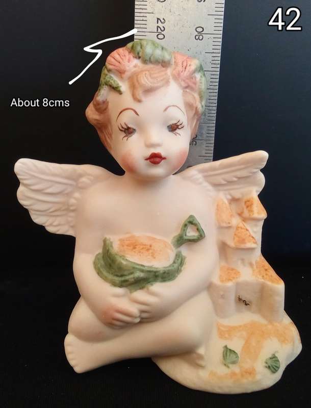 Beautiful  hand painted porcelain Angel with green beach bucket