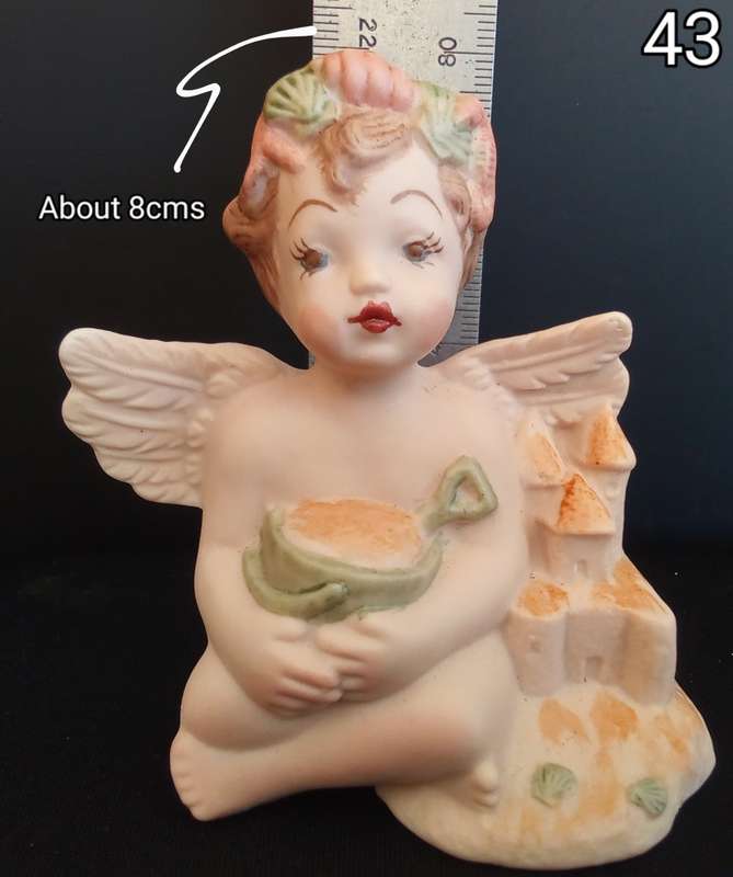 Beautiful  hand painted porcelain Angel with green beach bucket