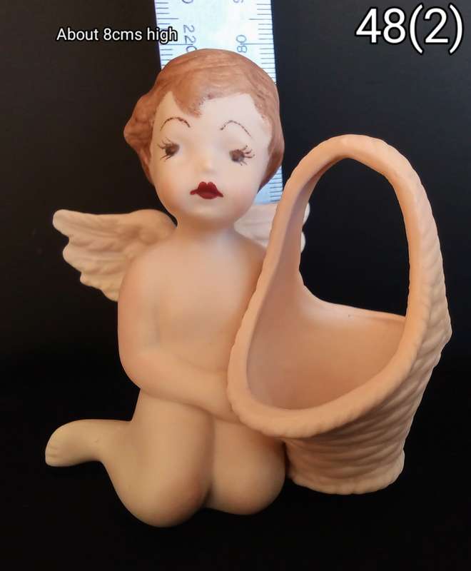 Beautiful hand painted porcelain Angel with basket