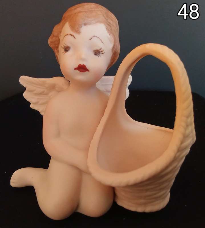 Beautiful hand painted porcelain Angel with basket