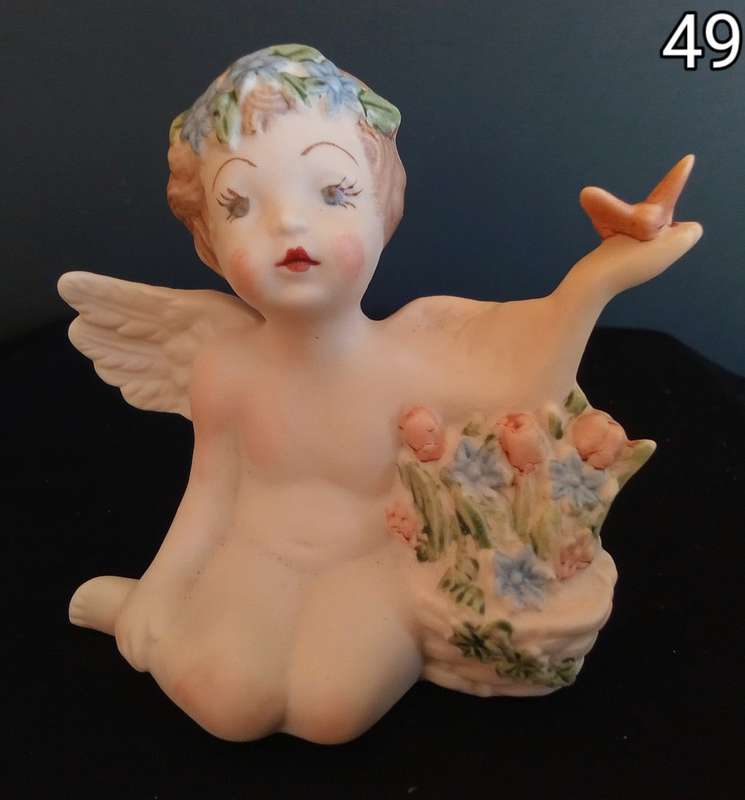 Beautiful hand painted porcelain Angel with butterfly