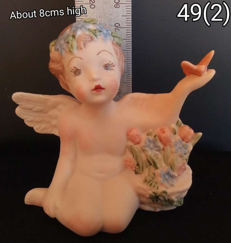 Beautiful hand painted porcelain Angel with butterfly