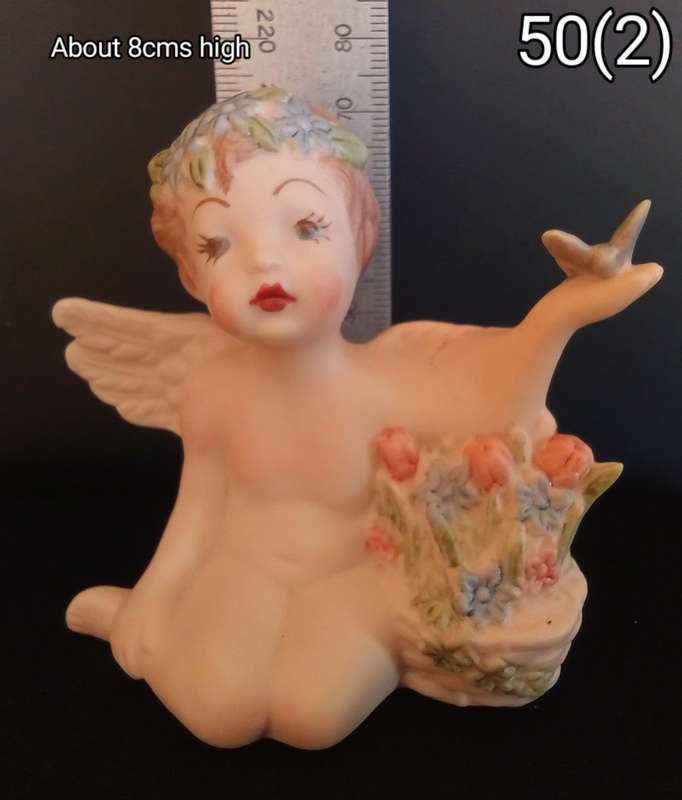 Beautiful hand painted porcelain Angel with butterfly